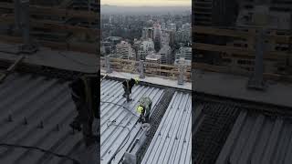 On site shot of bolt welding in the floor decking laying project aerialphotography steelstructure [upl. by Ettenrahs]