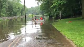 Boys canoe down flooded street to pick up grandpa [upl. by Anwahsat]