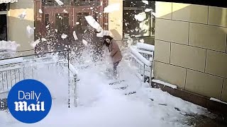 Terrifying moment avalanche of snow nearly collapses on womans head [upl. by Garrard67]