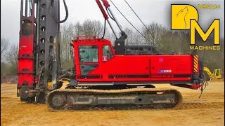 PILE DRIVER MACHINE WITH IMPACT HAMMER ERECTING CONCRETE FOUNDATIONS [upl. by Nordin]