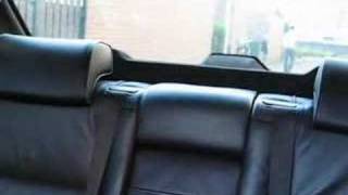 E38 BMW 740i Automatic folding headrests rear [upl. by Pownall819]