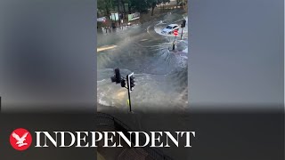 Burst water main leaves street in north London flooded [upl. by Shurwood]