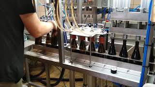 Small 4 head semiautomatic beer filler for craft breweries counter pressure [upl. by Maria]