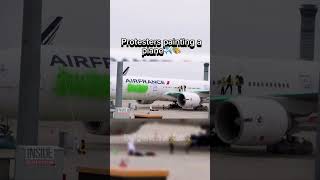 Protesters painting a plane commercialaviation commercialaircraft automobile avgeek aviation [upl. by Betteanne359]