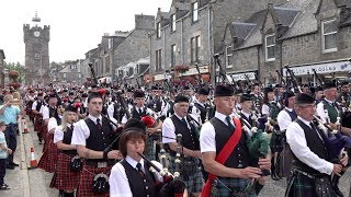 Chieftain leads almost 300 pipers amp drummers to the 127th Dufftown Highland Games in Moray Scotland [upl. by Huda370]