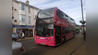 Southern vectis 1596 on route 2 coming into Newport in a pink livery with pictures of other buses [upl. by Assirhc]