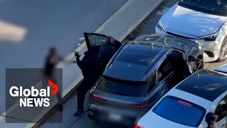 Video of violent Torontoarea robbery shows victim boxed in while thieves steal case full of cash [upl. by Aihpledalihp]