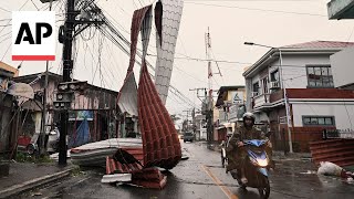 Typhoon Manyi blows off roofs and brings flooding to the Philippines [upl. by Brandenburg268]