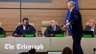 Shocking moment Georgian politician throws paint over election chief [upl. by Eadrahc]