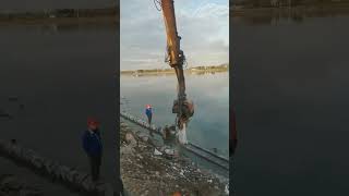 The process of driving cement piles for river cofferdams [upl. by Primo780]