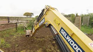 Leveling topsoil with a Mini Digger Yanmar SV26 Excavator [upl. by Nivi642]