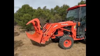 Grapple attachment on Kubota L3560 moving logs [upl. by Imerej]