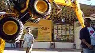 People passing under the JCB 4CX backhoe loader [upl. by Giorgia]