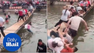 Hilarious game has people trying to shake opponents off a bridge [upl. by Kcirderfla806]