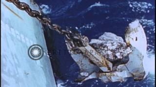 Anchor being pulled up a ship underway in the Pacific Ocean during World War II HD Stock Footage [upl. by Minni]