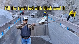 Lets watch the miners work together to manually fill the truck with black sand until it is full [upl. by Jeannine723]