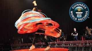 SPOTLIGHT  Most hula hoops spun simultaneously [upl. by Siclari]