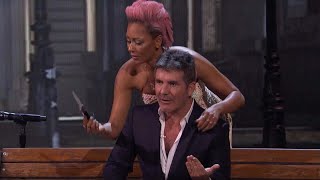 EXCLUSIVE Simon Cowell Reacts to Mel B Stabbing Him During Surprising Americas Got Talent Act [upl. by Anatola]