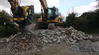 MB crusher bucket BF903 crushing blue stones and demolition material [upl. by Notxam]