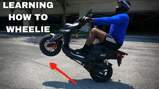 LEARNING HOW TO WHEELIE A SCOOTER  50cc SCOOTER WHEELIES [upl. by Sumetra]