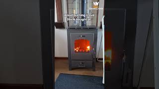 Freestanding steel wood stove  Powerful 26kW heating connectable to central heating system [upl. by Beker]