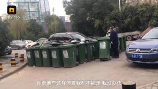 Elderly cleaner in China barricaded illegally parked car with 40 rubbish bins [upl. by Gardie]