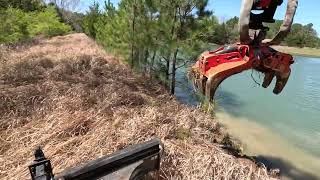 Rotobec mini pc grapple is incredible for this type work clearing off a pond dam [upl. by Kato]