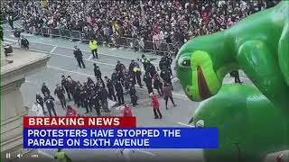 ProPalestinian protesters appear to glue hands to street during NYC Macys Thanksgiving Day Parade [upl. by Jacoba]