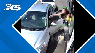 Seattle bikini barista shatters windshield with hammer after customer throws drinks at her [upl. by Even]