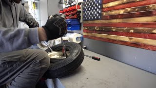 How to install a New Trailer tire on the rim with basic tools [upl. by Holmann]