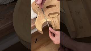 Shaping the body contours luthier guitar customguitar luthiery guitarbuilding woodworking [upl. by Oiramat]