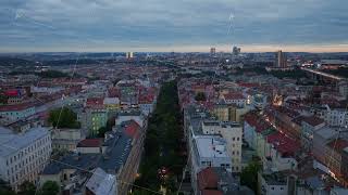 Aerial views showcase Prague at dusk revealing the city as lights brighten stunning architecture [upl. by Wolfie]