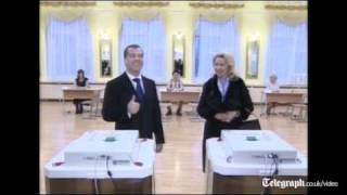 Russian President Dmitry Medvedev and Prime Minister Vladimir Putin vote [upl. by Elnukeda]