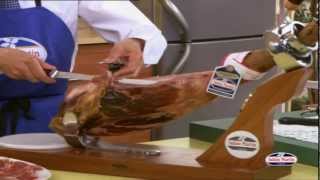 How to Carve Iberico Ham from wwwfoodsofspaincouk  Spanish Food Online [upl. by Merill467]