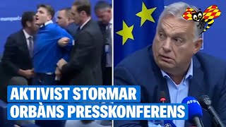 Putinanklagelsen under Orbáns pressträff – aktivist stormar in [upl. by Adeirf722]