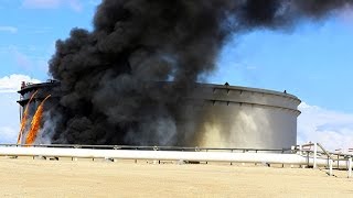 Rocket hits storage tank at Libyas biggest oil port [upl. by Bone]