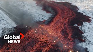 Iceland volcano Mesmerizing drone video shows bubbling lava swallow road near Blue Lagoon [upl. by Cato544]