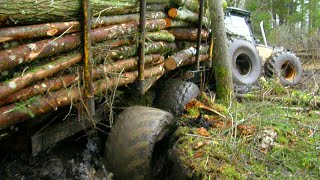 Valtra forestry tractor stuck in mud with big fully loaded trailer [upl. by Yrtneg]