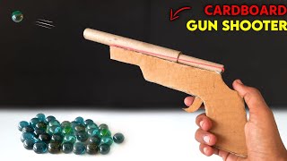 how to make cardboard gun powered by rubberband  Marble shooting gun  easy shooting toy [upl. by Rairb94]