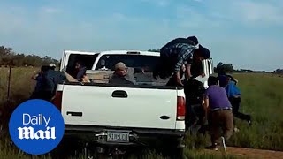 Dozens of migrants leaps out of pickup truck during police stop [upl. by Albertine]