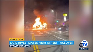 Jeep set on fire during chaotic street takeover in Los Angeles [upl. by Ohcamac]