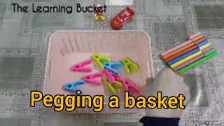 Pegging a basket  Montessori practical life exercise [upl. by Kcirre]