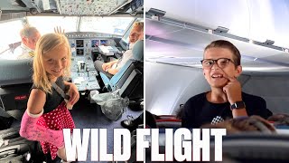 WILD FLIGHT WITH 7 KIDS TO DISNEYLAND  TOO TURBULENT FOR FOOD SERVICE AND LOSING TOOTH ON A PLANE [upl. by Aneekat]