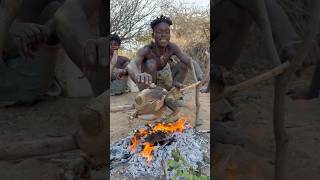 Hadzabe cooking the Whole guinefowl on the fire  primitive cooking [upl. by Guillaume]