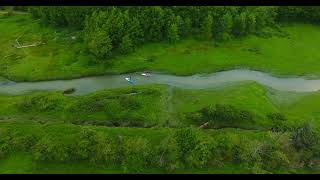 paddlers on a narrow channel windy day drone views [upl. by Arais]