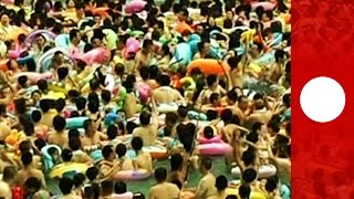 Thousands pack Chinese wave pools to escape summer heat [upl. by Aidile]