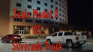 Model X Towing a Chevy Silverado Truck out of a Supercharger Station [upl. by Sarson]