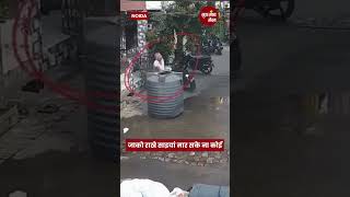 Water Tank Falls Woman Eating Apple Escapes Unharmed – Watch shorts viralvideo [upl. by Eillo]