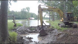 Dredging the head section of a pond [upl. by Dov43]