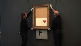 La toile autodétruite de Banksy accrochée à BadenBaden [upl. by Sulrac]